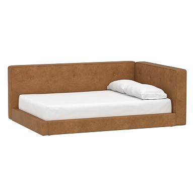 a bed that is made out of wood and white sheets