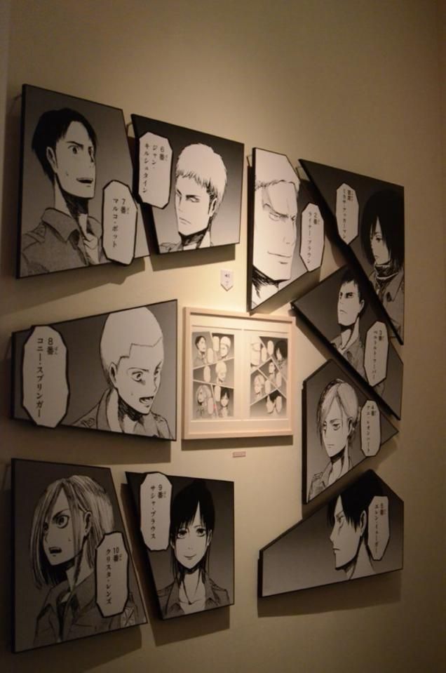 a wall with many anime pictures hanging on it