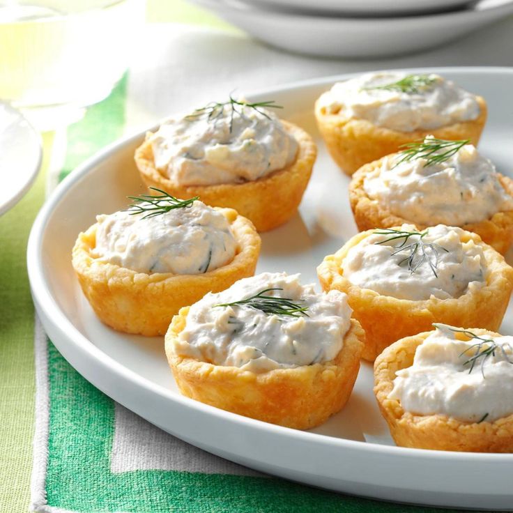 small appetizers with cream cheese and herbs on a plate