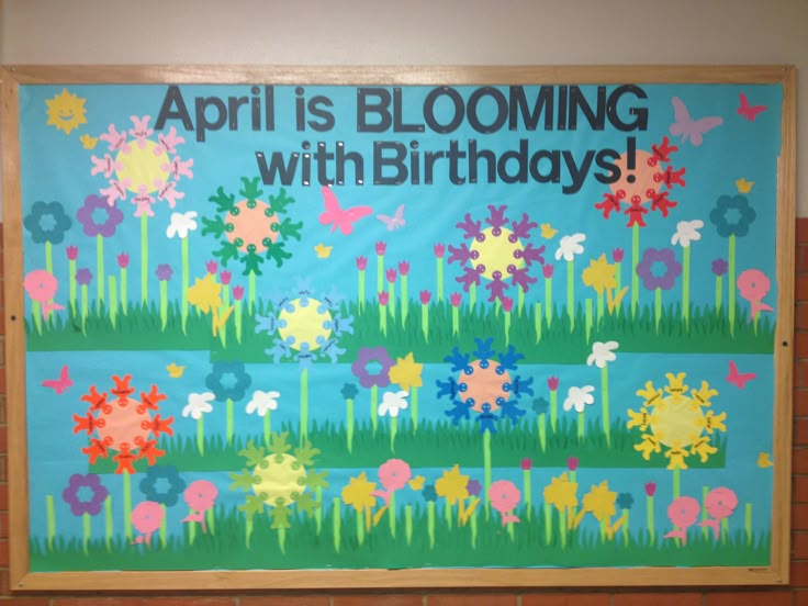 a bulletin board with flowers on it that says, april is blooming with birthdays