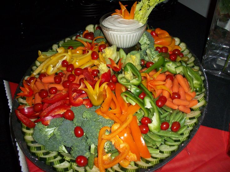 a platter filled with lots of different types of vegetables