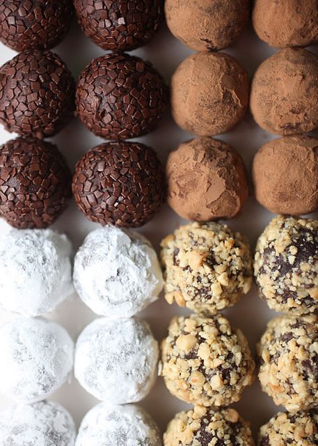 several different types of cookies and pastries on a white surface