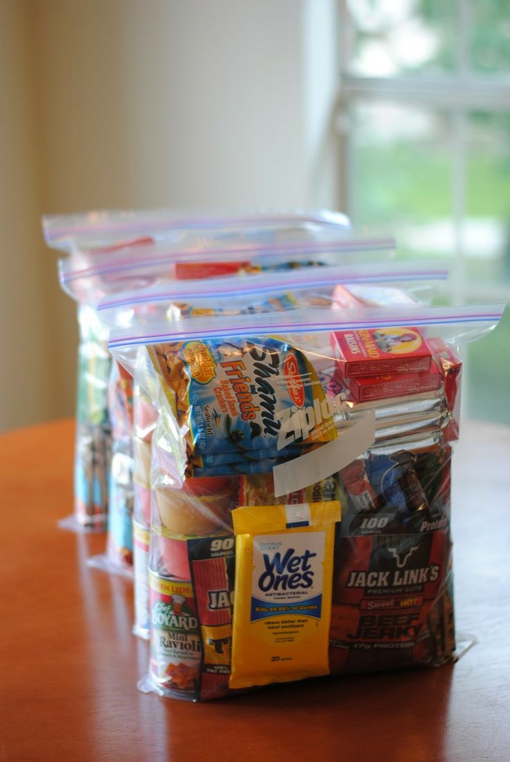 several packaged snacks sitting on top of a wooden table