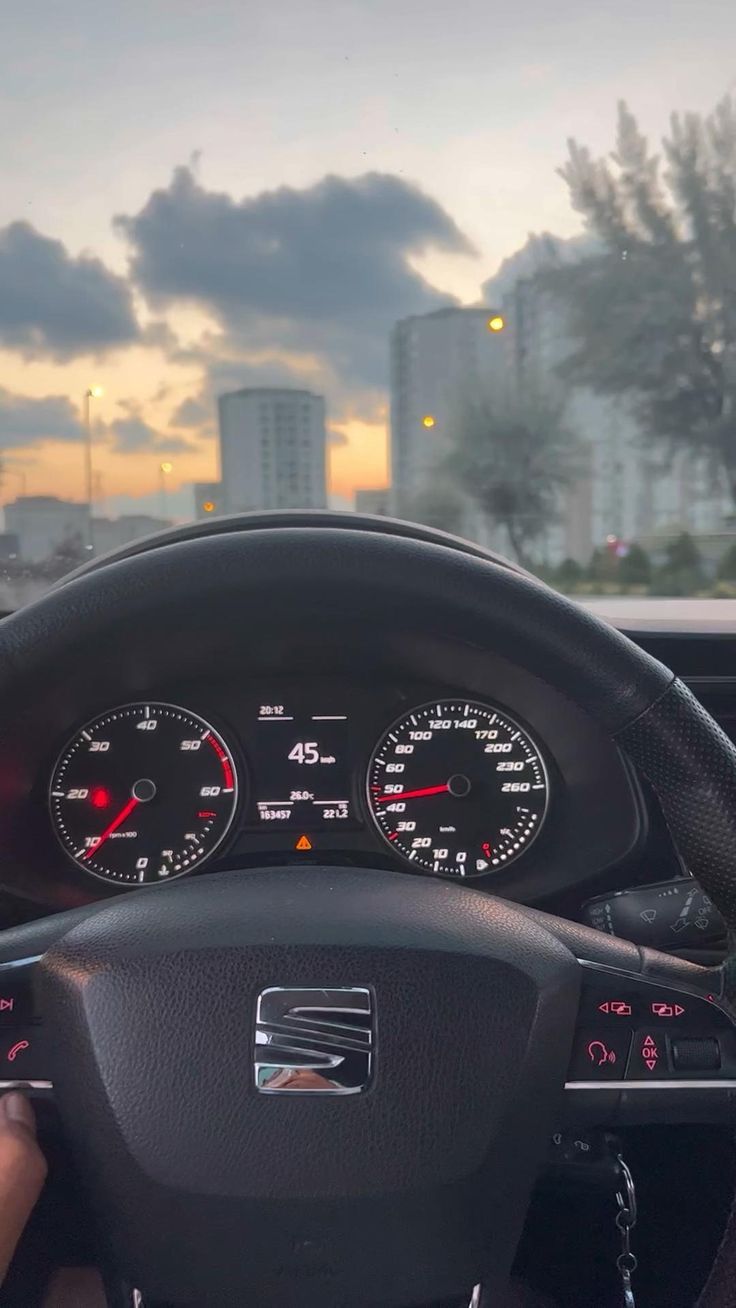 the dashboard of a car with speedometers and gauges in front of it