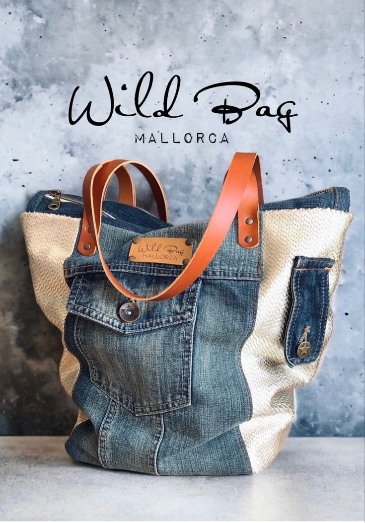 a bag made out of jeans and leather with the words wild bag malloroa on it