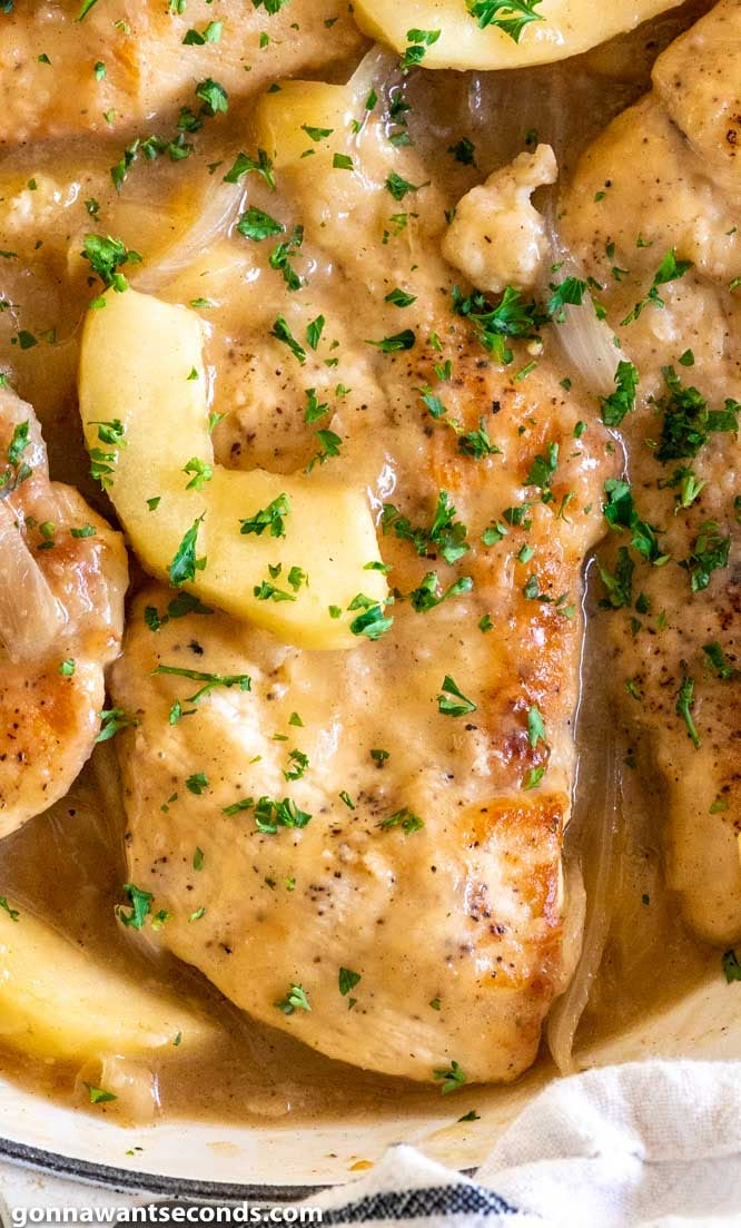 chicken with potatoes and gravy in a white bowl