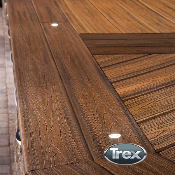 a close up of a wooden table with a sticker on the edge that says trex