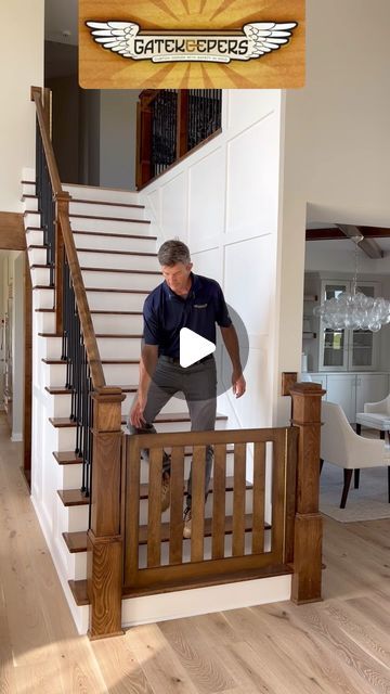 a man standing on top of a wooden banister