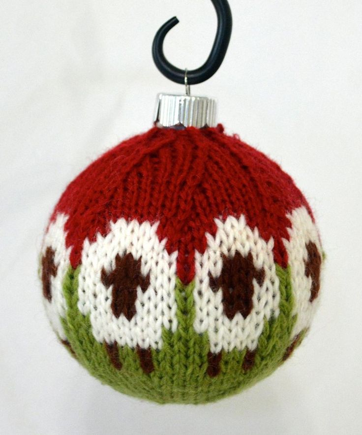 a knitted christmas ornament hanging from a hook