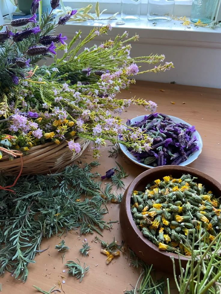 two bowls filled with different types of flowers