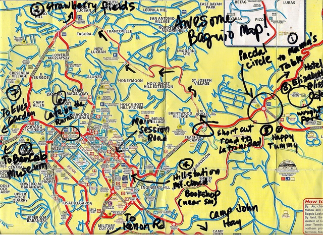 a yellow map with blue and red lines on the bottom, and words written in black