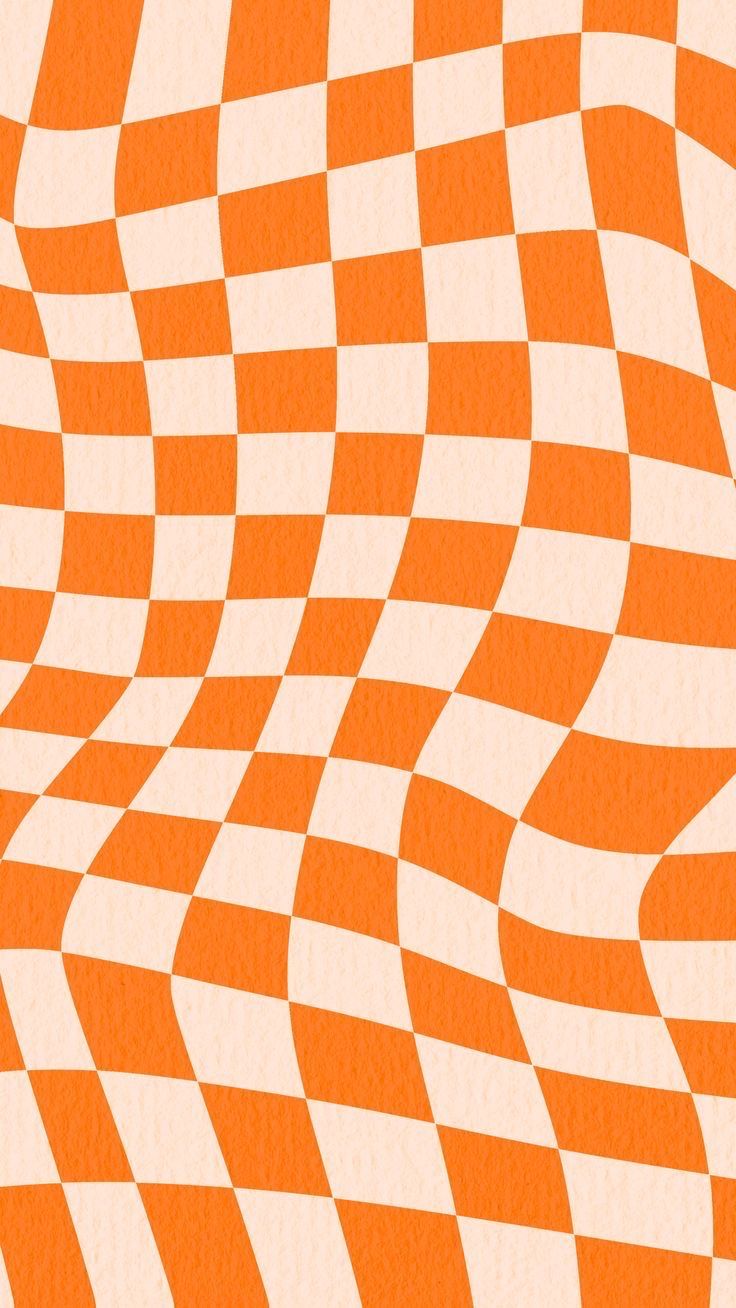 an orange and white checkerboard pattern is seen in this image, it appears to be made out of paper