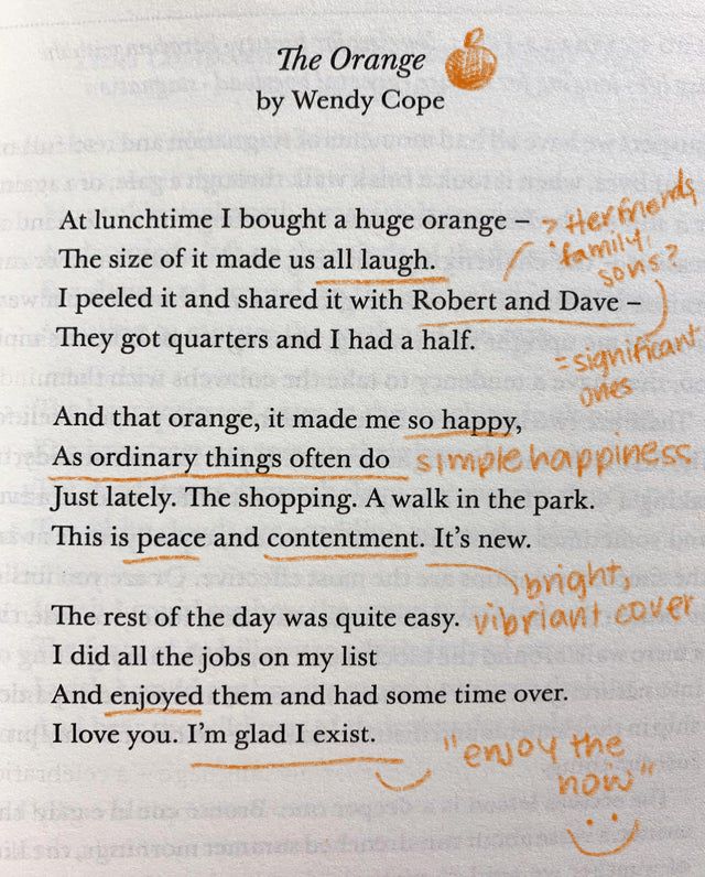 an open book with orange writing on it