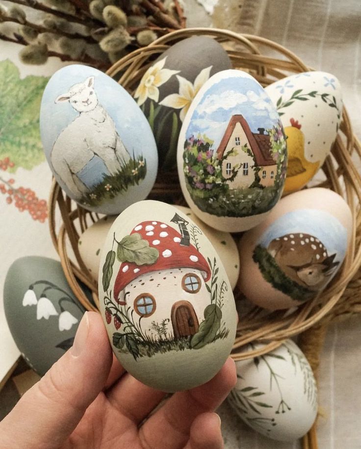 hand painted eggs with houses and mushrooms on them