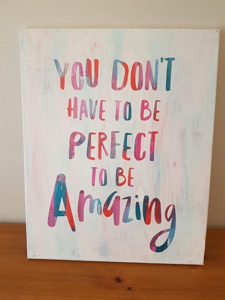 a painting on a wooden table that says you don't have to be perfect to be amazing