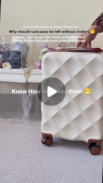 a woman standing next to a piece of luggage on top of a carpeted floor