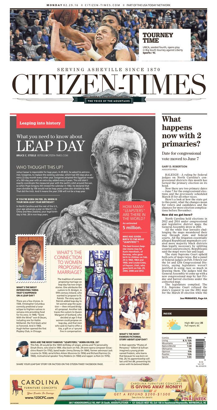 the front page of a newspaper with an image of a statue