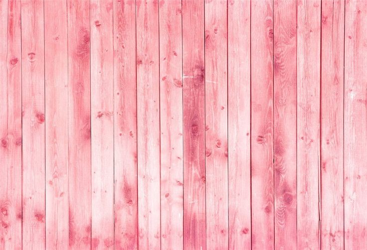 a pink wooden wall with planks that are painted in shades of pink and white