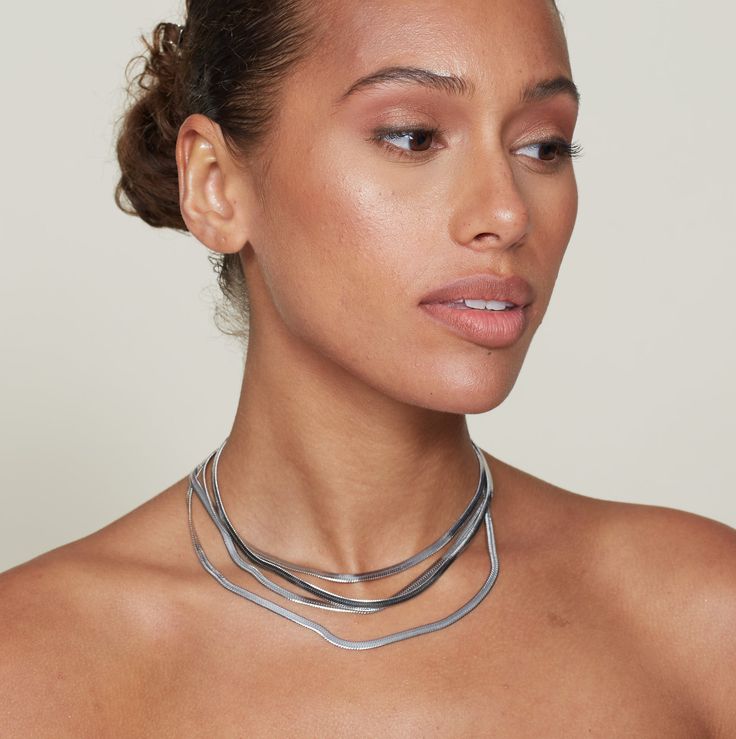 An elegant yet timeless 3mm silver herringbone chain necklace and bracelet combo for all your stylish needs! A timeless accessory to fit any personality, so you can rock it however you like. Look good, feel good, and get out there and do you! Stainless Steel Measurement Necklace:16" Bracelet: 6" Lobster Closure 100% Eco-Friendly; No Nickel, Chromium and Lead Water-resistant, sweat-proof, hypoallergenic and tarnish-free. You can work out in our durable jewelry, wear it to the beach, pool or even Chains Layered, Fun Pendant, Bracelet Combo, Herringbone Chain, Herringbone Necklace, Silver Chains, Look Good Feel Good, Forever Jewelry, Necklace And Bracelet