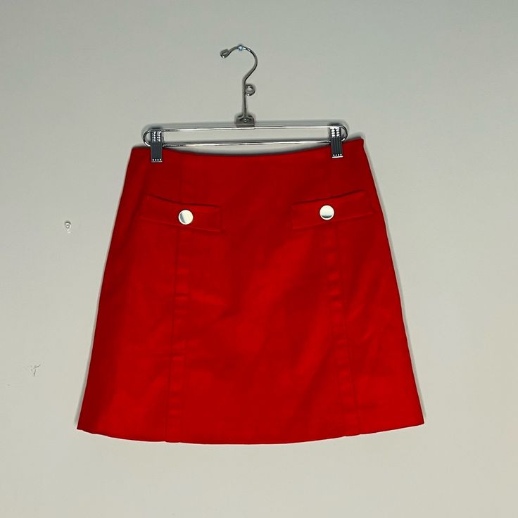 Super Chic Red Mini Skirt. Gold Button Pocket On Front. Wool Like Feel. New With Tags Red Cotton Bottoms With Buttons, Red Mini Skirt With Button Closure, Retro Red Skort, Red Buttoned Skirt, Red Buttoned Bottoms For Work, Fitted Red Skirt With Button Closure, Red Skort With Pockets For Spring, Red Summer Skirt With Button Closure, Red Fitted Skirt With Buttons