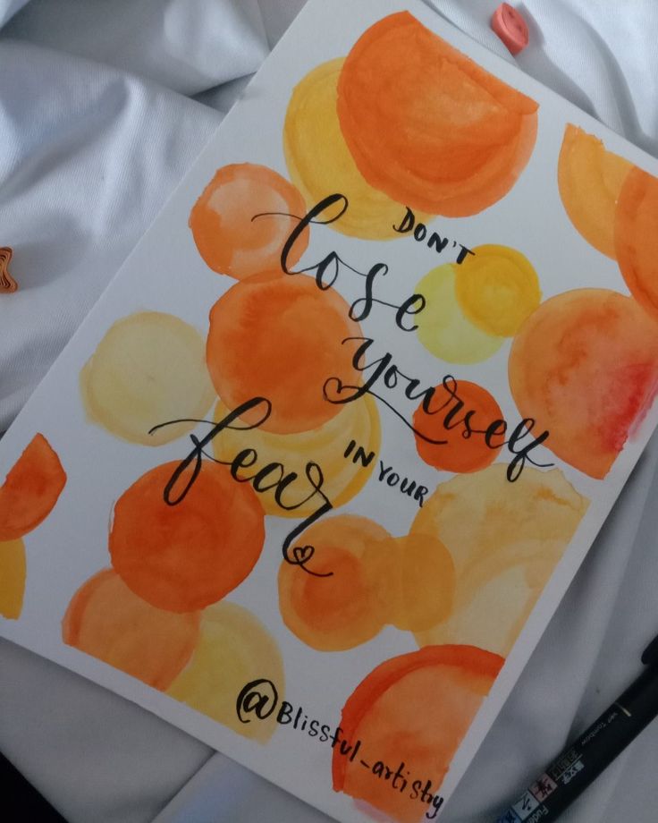 an orange and yellow watercolor painting with the words don't use your fear in your life