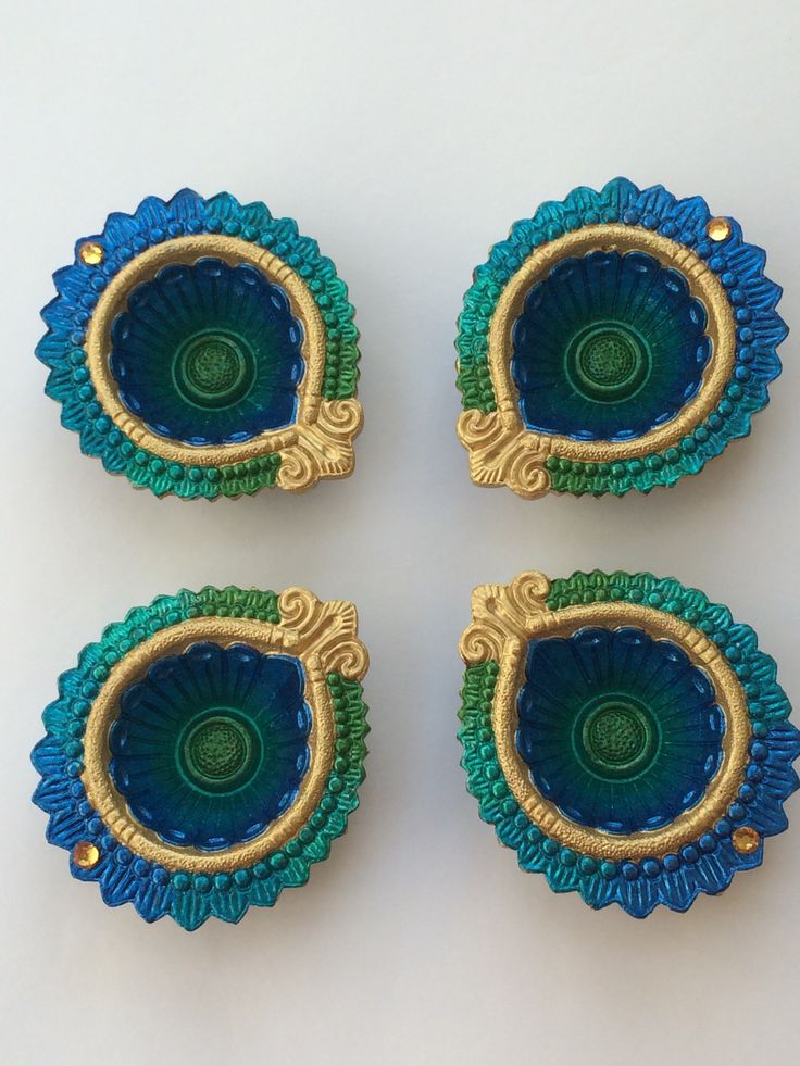 four pieces of blue and green glass with gold trim