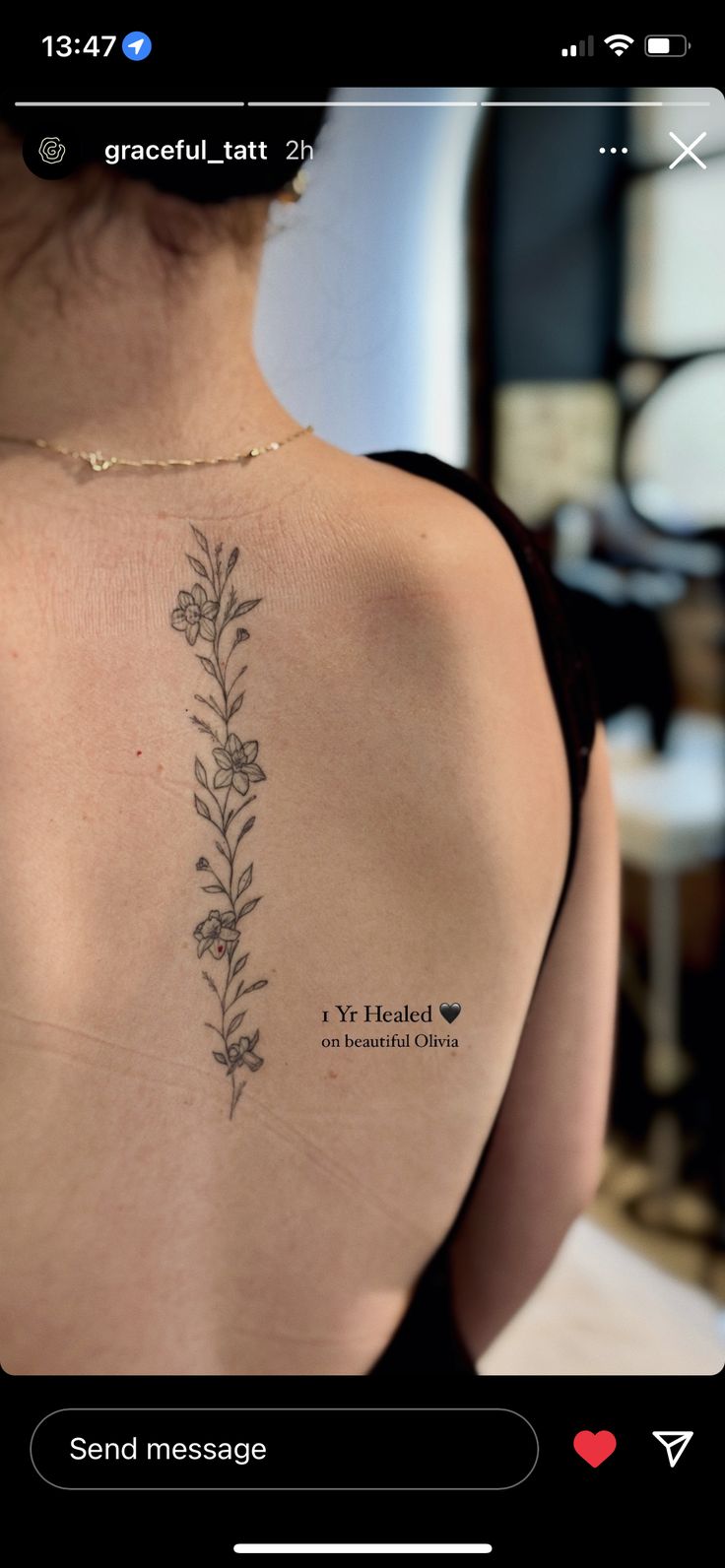 the back of a woman's shoulder with flowers tattooed on her left arm and chest