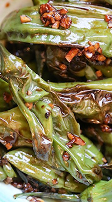 green peppers with chili flakes and seasoning in a bowl