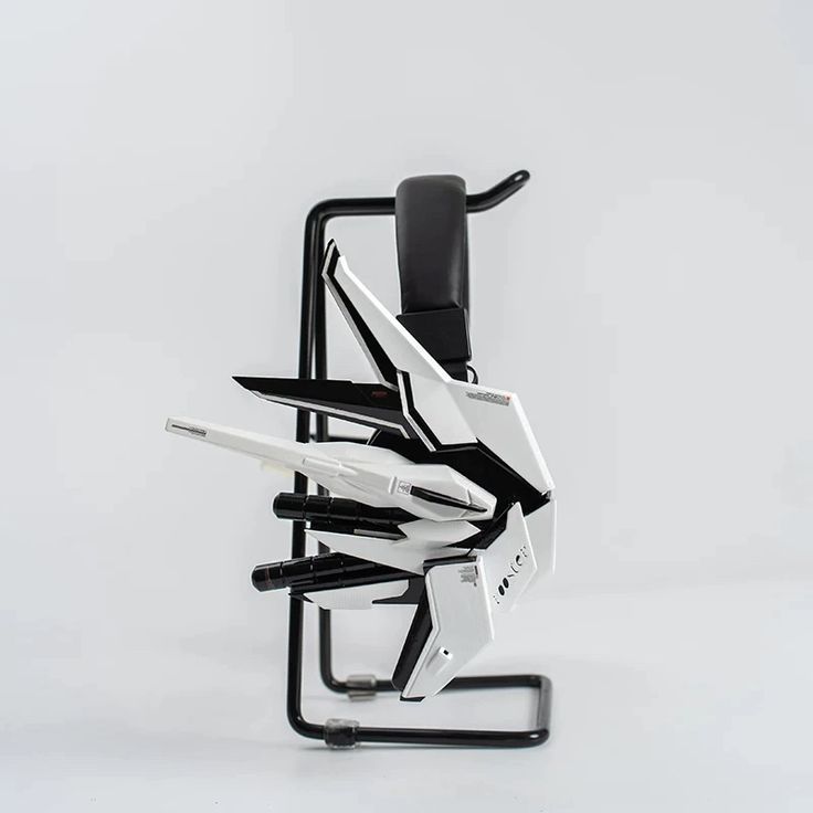 an office chair made out of multiple pieces of metal and black leather, on a white background