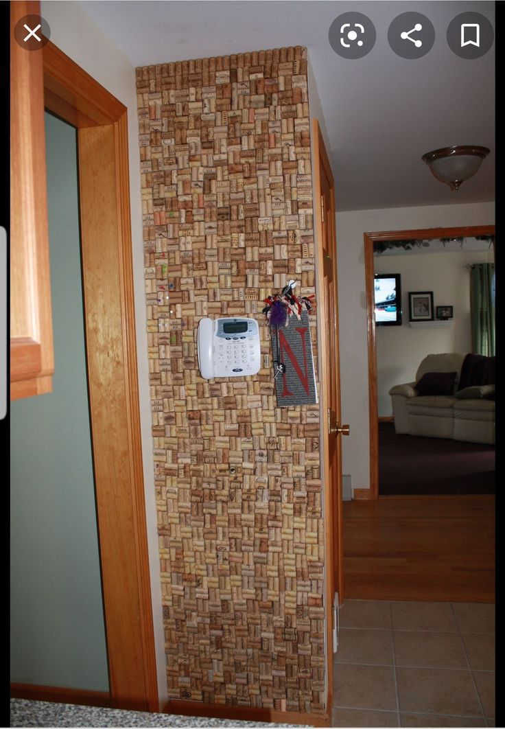 a wall mounted air conditioner on the side of a brick wall in a living room