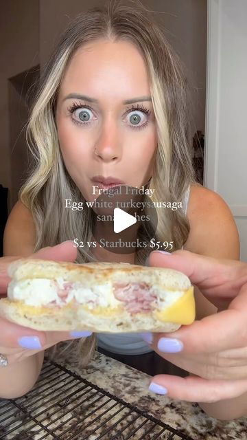 a woman holding a sandwich in front of her face with the caption, egg white muffins