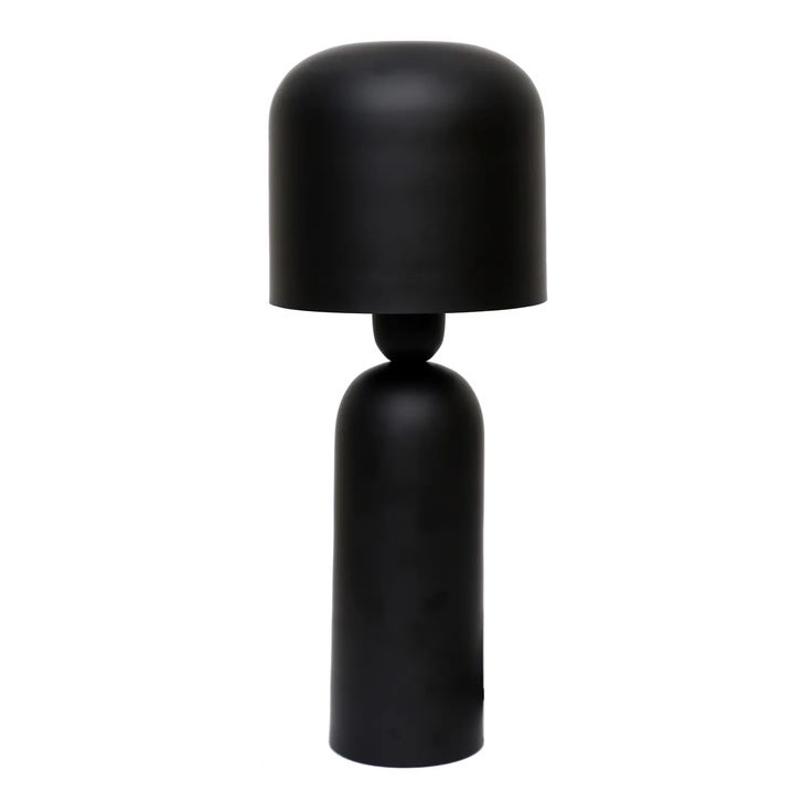 a black table lamp sitting on top of a white floor