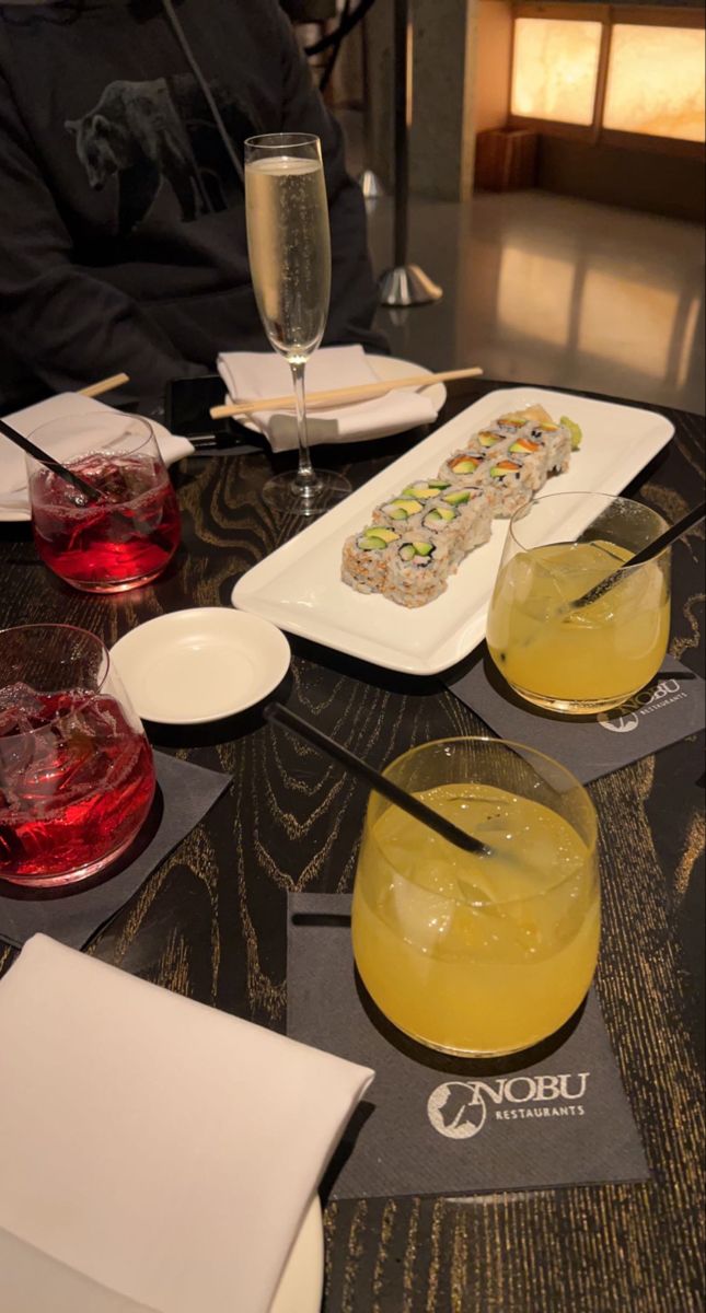 a table topped with plates and glasses filled with drinks