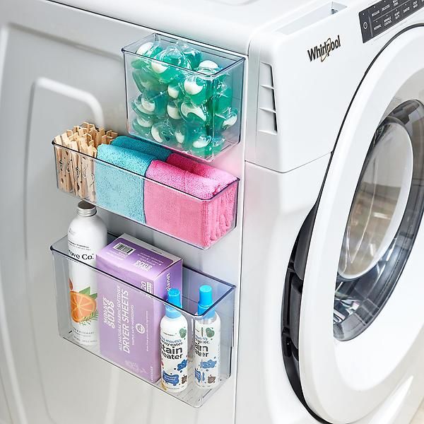 a washer and dryer sitting next to each other in front of a washing machine