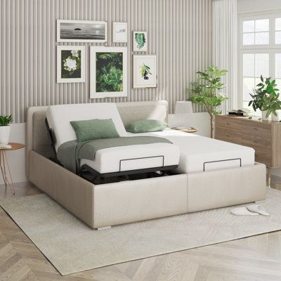 a white bed sitting on top of a wooden floor