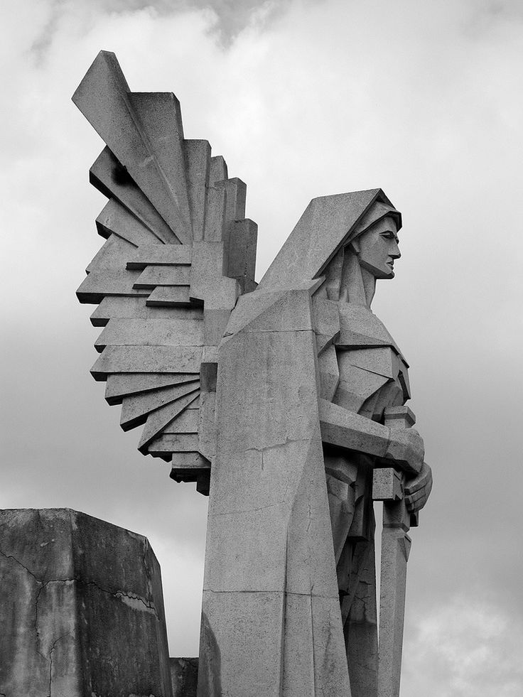 a black and white photo of a statue