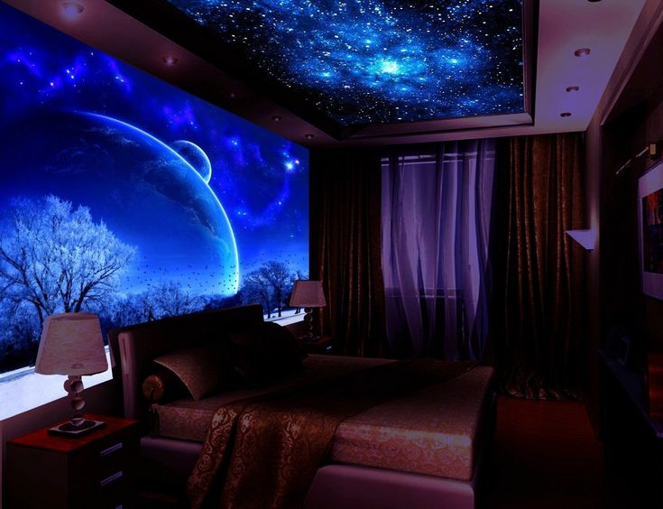 the ceiling is decorated with stars and planets in this bedroom, it's lit up