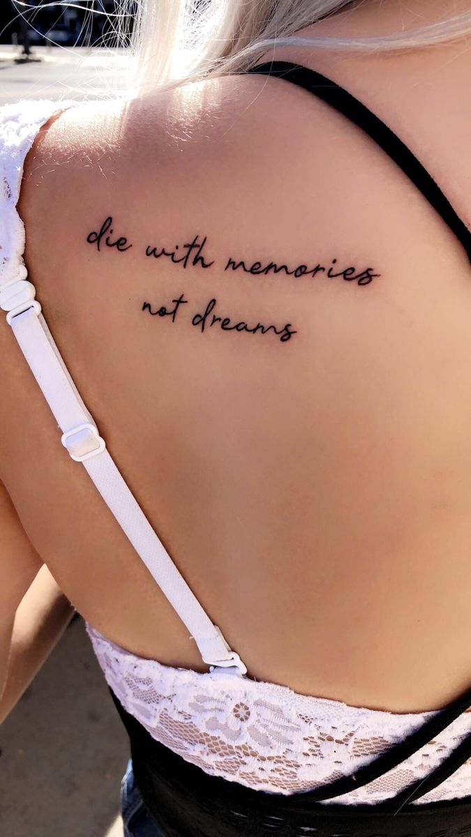 the back of a woman's shoulder with an inscription on it that reads, be with memories not dreams