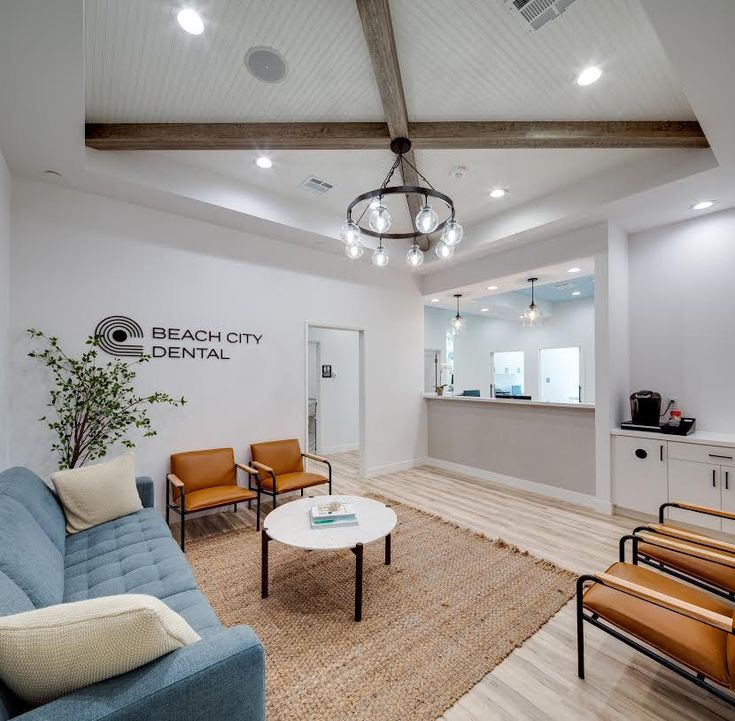 a living room filled with furniture and a chandelier