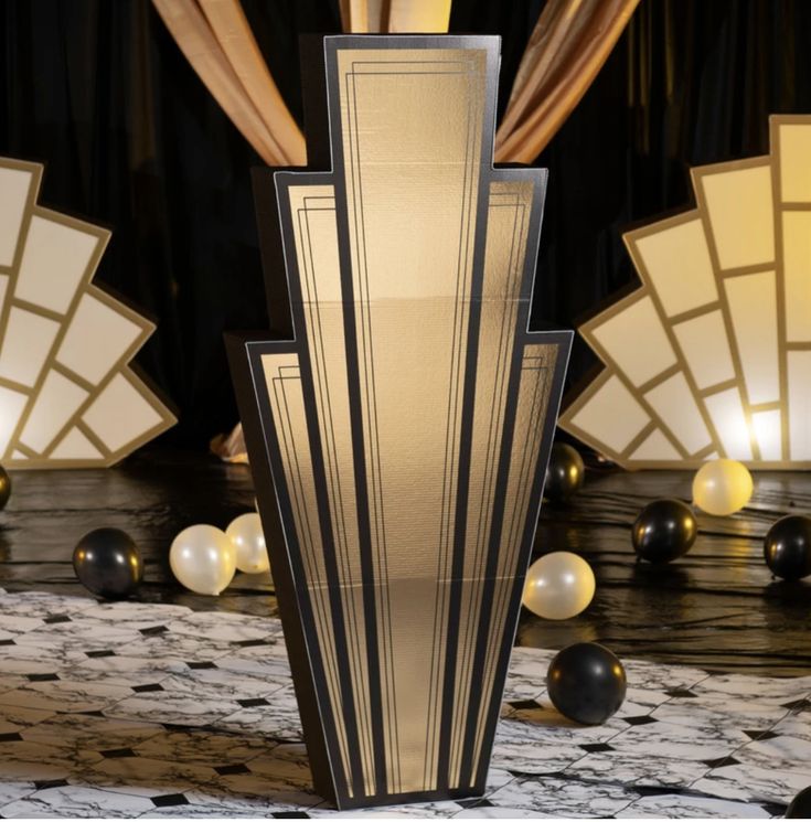 an art deco table lamp in the middle of a room with black and white decorations