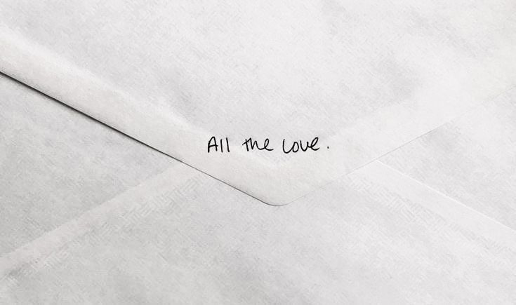 an envelope with the words all me love written on it