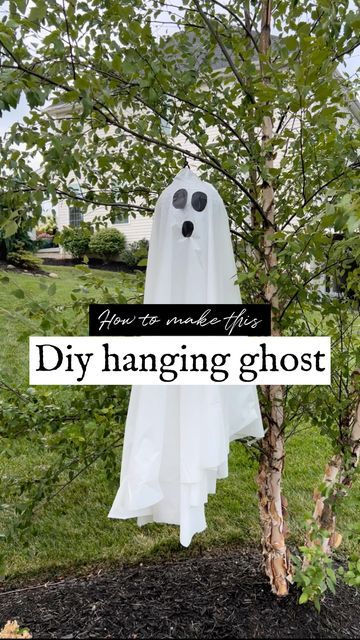 a ghost hanging from a tree with the words diy hanging ghost