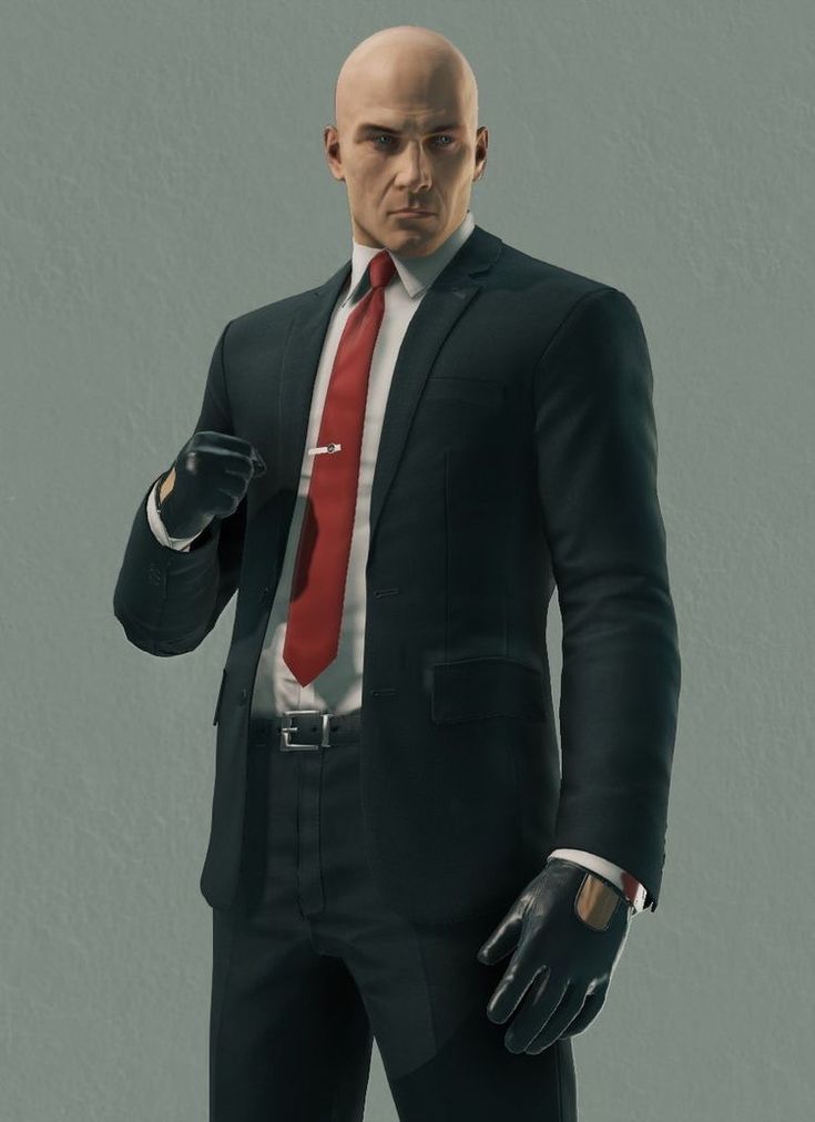 a man in a black suit and red tie with his hand on his hip wearing gloves