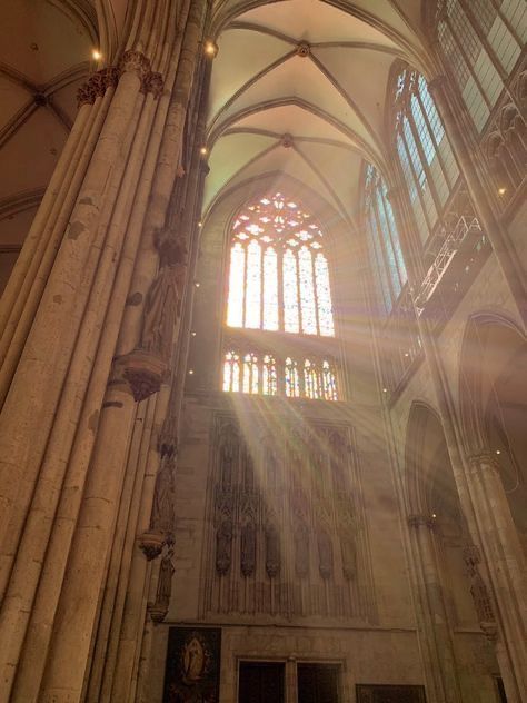 sunlight shining through the windows in an old cathedral