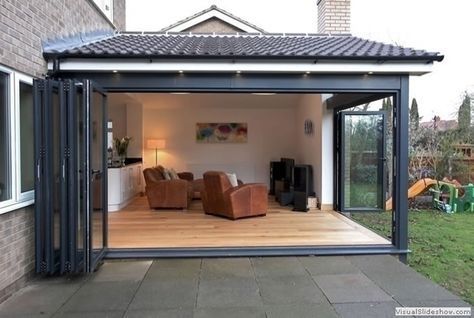 an outdoor living area with sliding glass doors