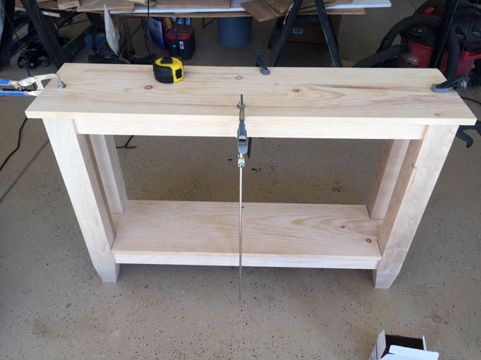 a workbench made out of wood with tools on it