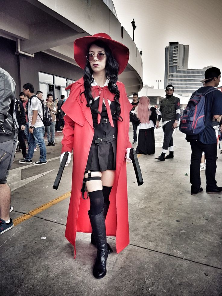 a woman in a red coat and hat