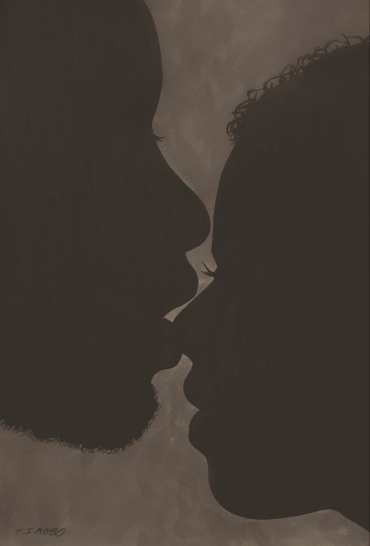 the silhouette of two people kissing each other