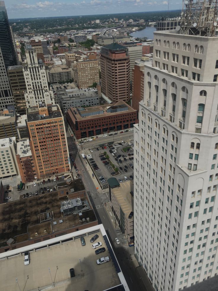 an aerial view of the city with tall buildings