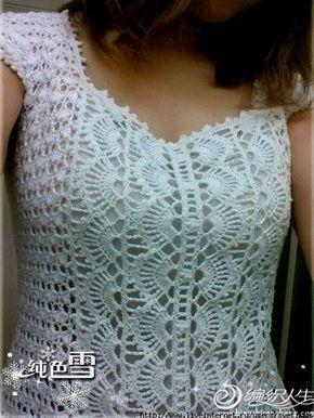 the woman is wearing a white top with lacy crochet on it's shoulders